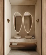 Deux miroirs LUMIRIS irréguliers rétroéclairés design moderne vue de face, installation sur mesure pour salle de bain au Maroc