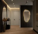 Miroir IRIS avec halo lumineux diffus et effet rétroéclairé sur mur texturé