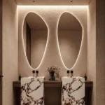 Miroir LUMIRIS irrégulier rétroéclairé design moderne pour salle de bain ou chambre, fabrication sur mesure au Maroc