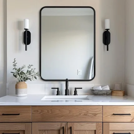 miroir rectangulaire à coins arrondis avec cadre en métal antirouille, vue en face posé sur un vasque, design moderne pour salle de bain
