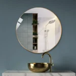 miroir rond en laiton doré vue de face, design moderne fabriqué au Maroc, idéal pour salle de bain ou salon