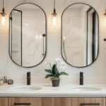 deux miroirs semi-ovales avec cadre en métal antirouille vus en face, design moderne pour salle de bain ou chambre