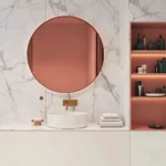 Miroir rose gold ROSEVEIL avec éclairage LED créant une ambiance chaleureuse et moderne dans la salle de bain.